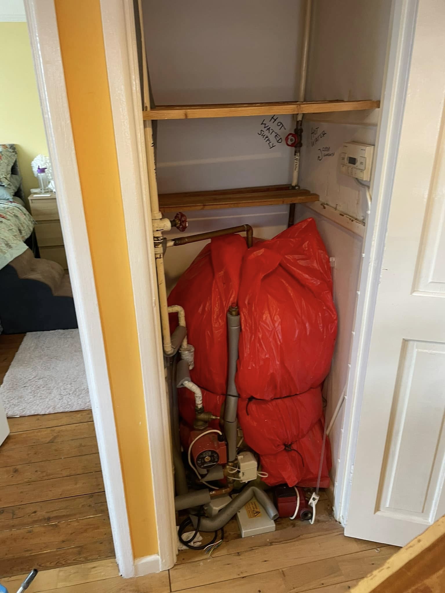 Older insulated hot-water cylinder and heating equipment